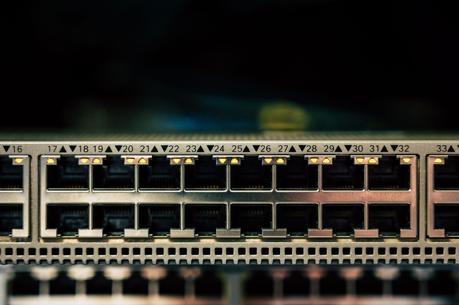Close-up of a multi-port PoE switch showing numerous gigabit ports